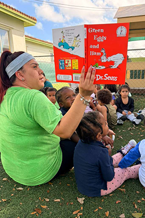Group of children listening to storytime at early literacy preschool Miami SF School Early Literacy